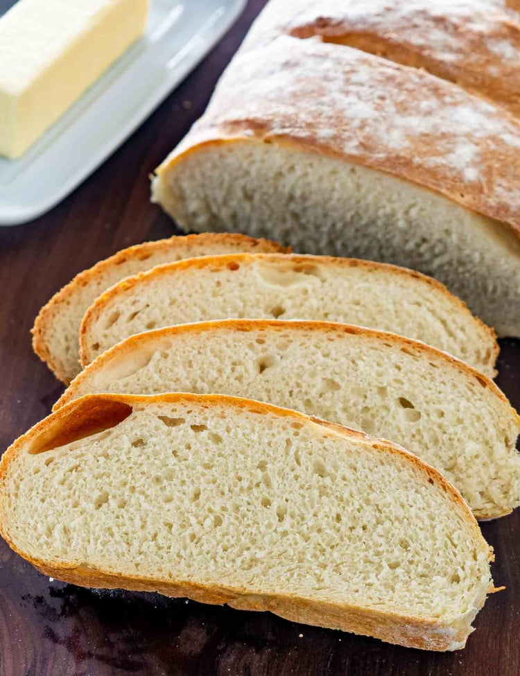 sliced artisan bread on a cutting board.