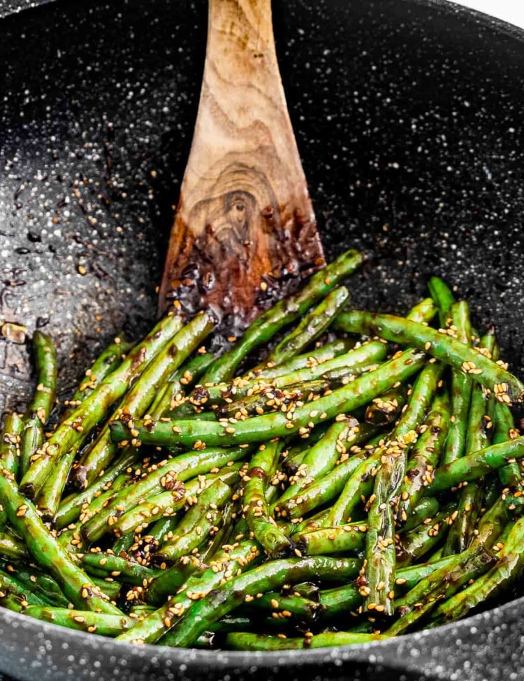 asian green beans in a wok.