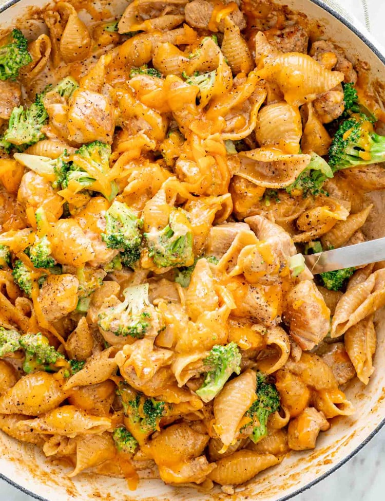 cheesy chicken broccoli pasta in a skillet freshly made.