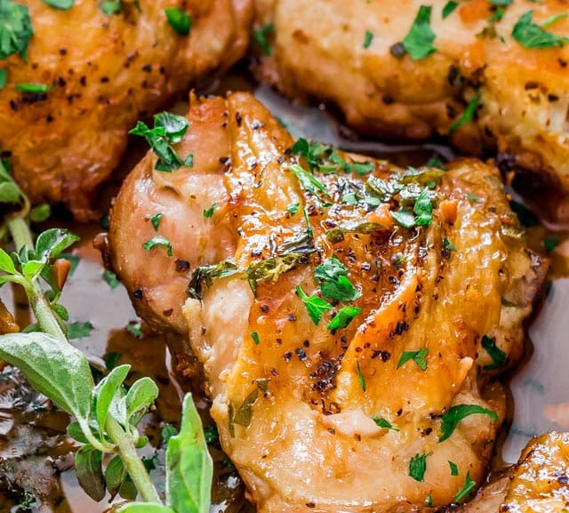 close up shot of chicken in garlic and herb sauce