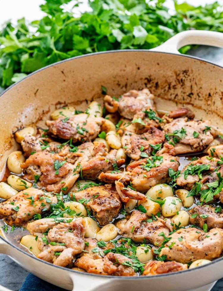 chicken with 40 cloves of garlic in a Dutch oven.