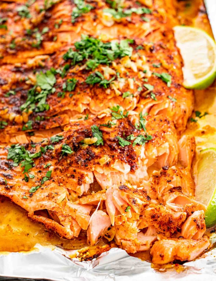 flaked up cilantro lime salmon on a baking sheet.