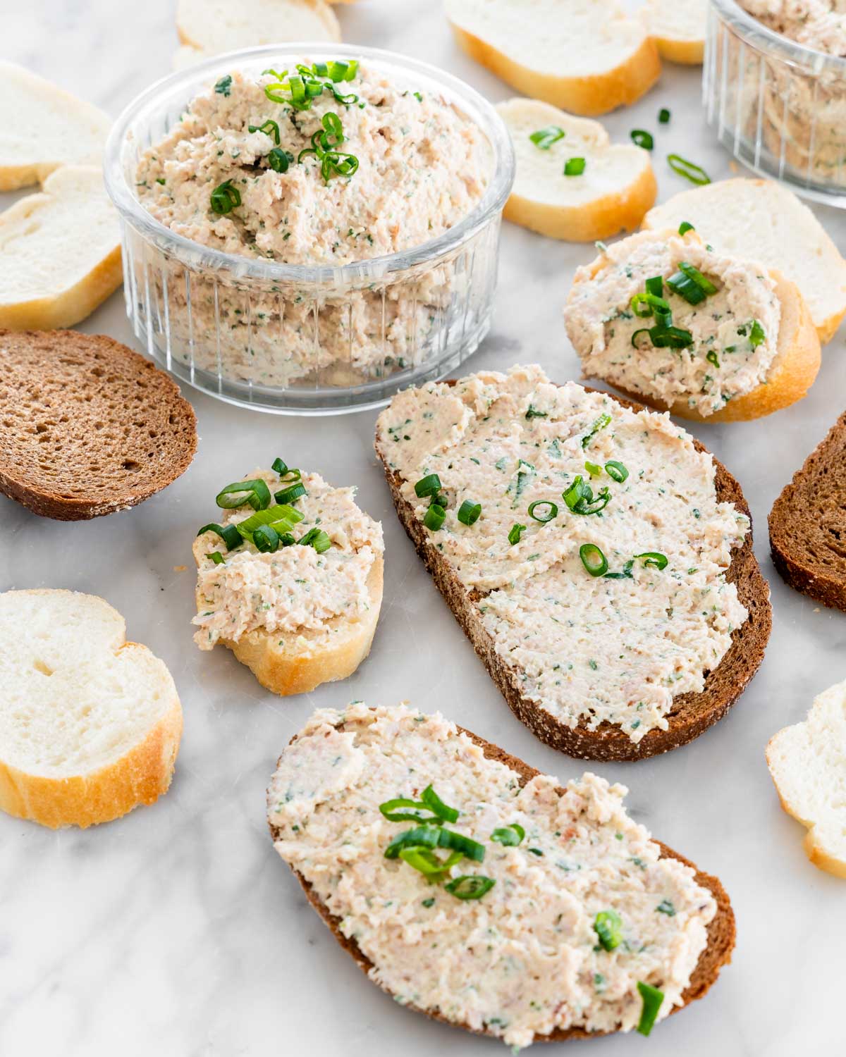 a few slices of bread with deviled ham spread over them