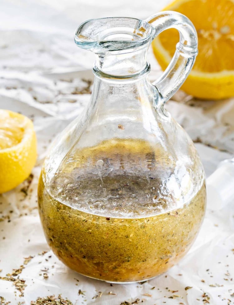 freshly made greek salad dressing in a jar.