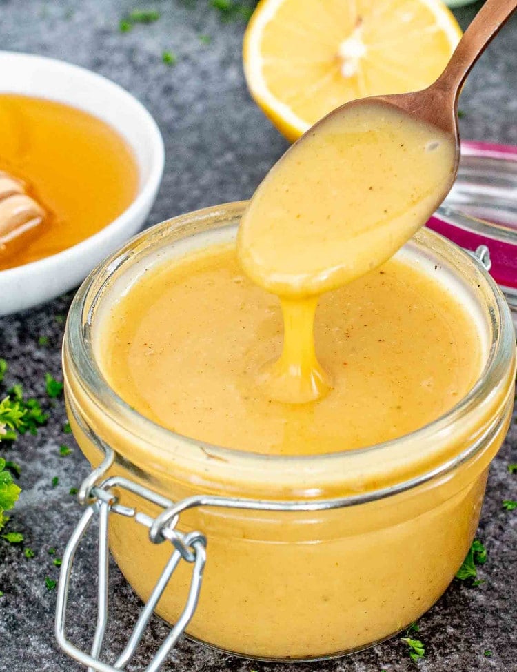 freshly made honey mustard sauce in a jar.