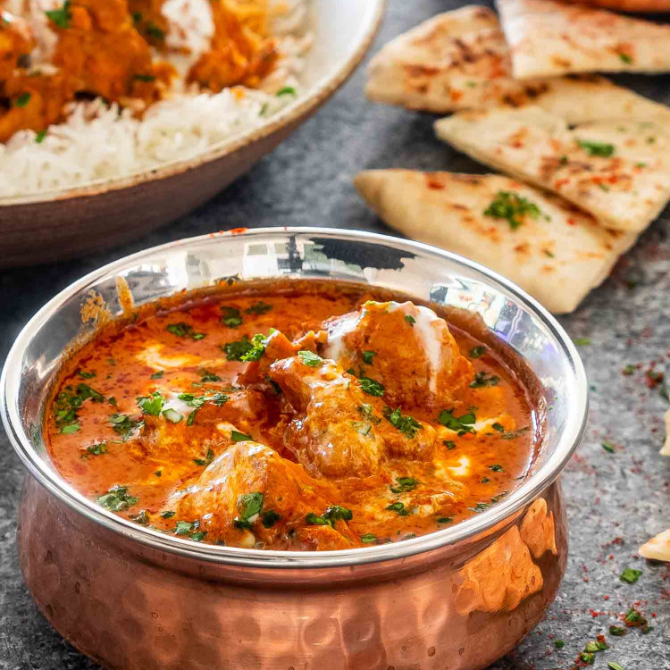 butter chicken made in the instant pot in a indian bowl.