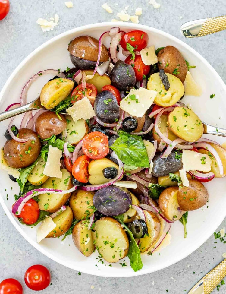 freshly made Italian Potato Salad in a white serving bowl.