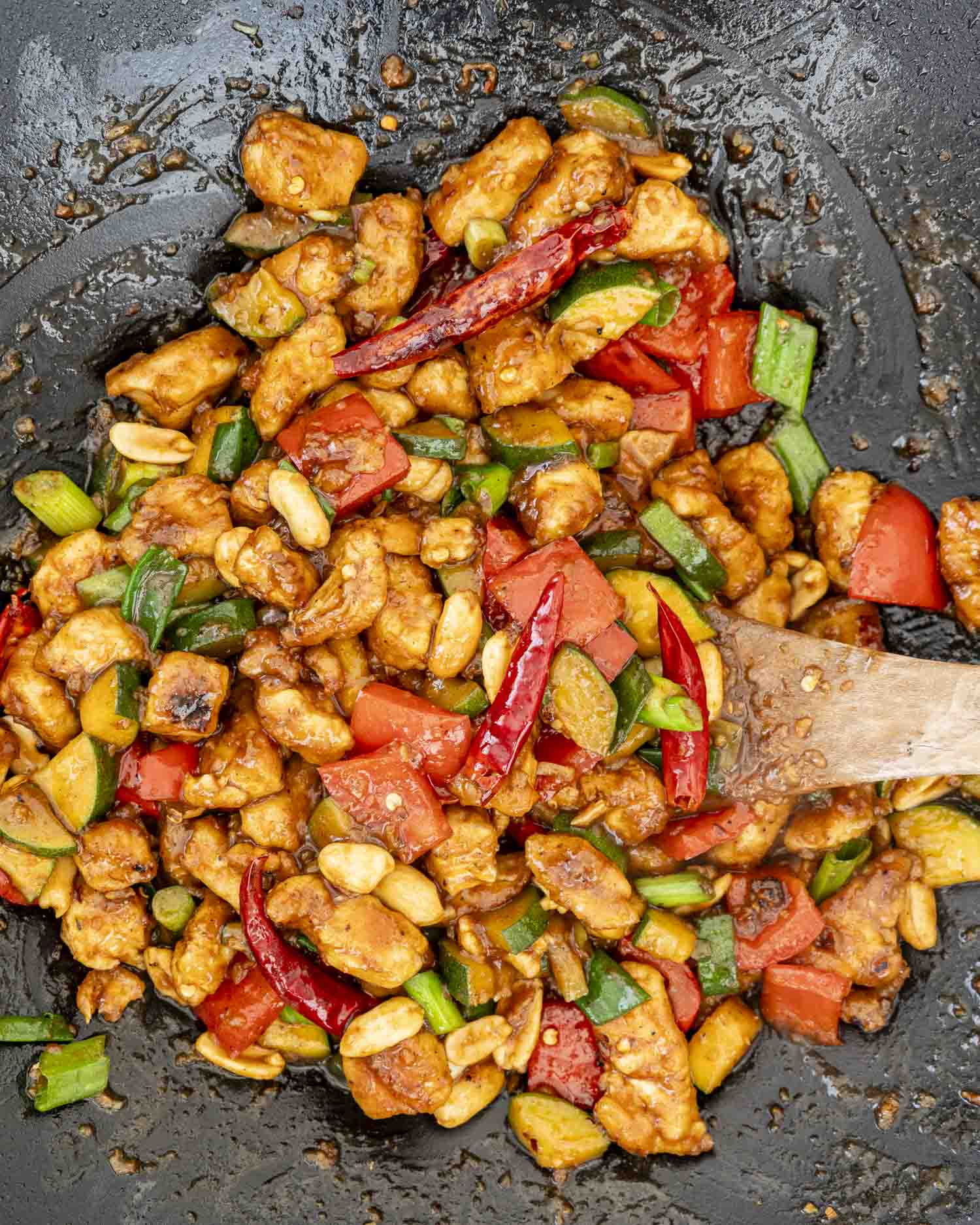 closeup of kung pao chicken in a wok.