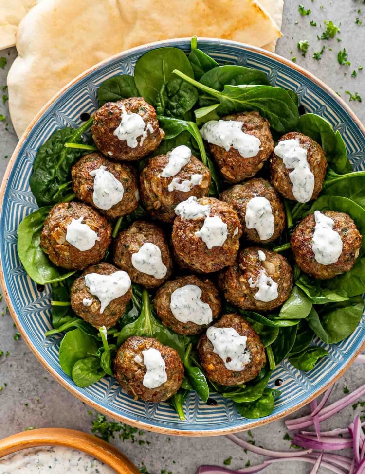 lamb meatballs with yogurt mint sauce in a bowl.