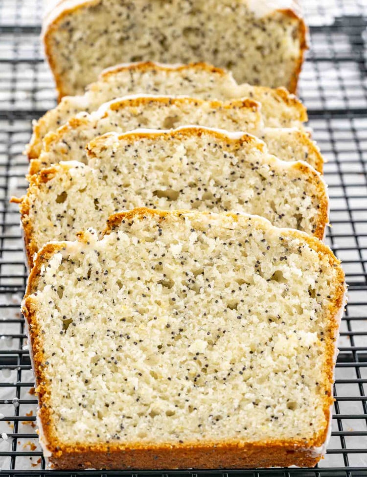 slices of lemon poppy seed bread on a cooling rack.