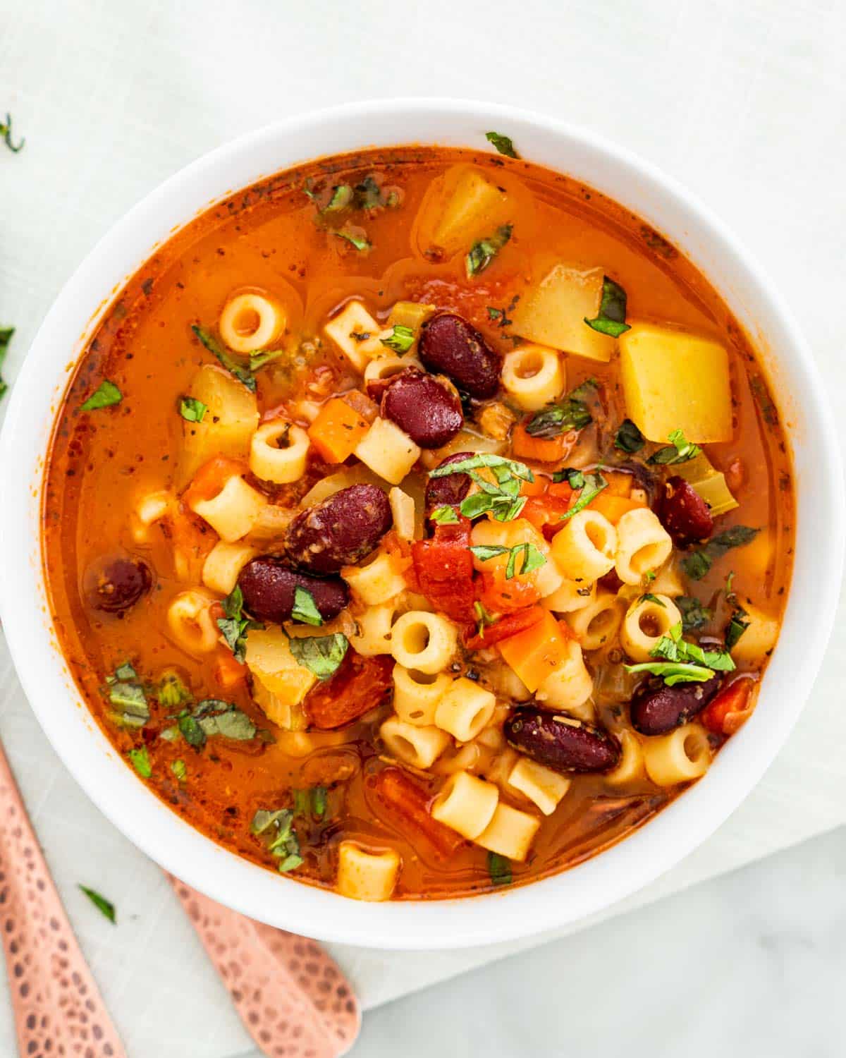 overhead shot of a bowl of minestrone soup