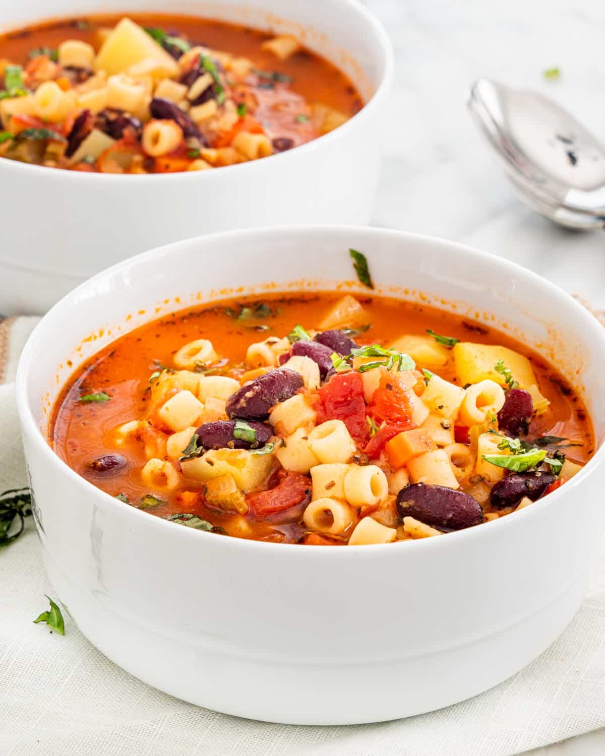 two bowls of minestrone soup