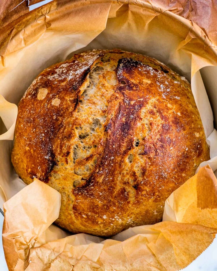 no knead whole wheat bread in a dutch oven fresh out of the oven.