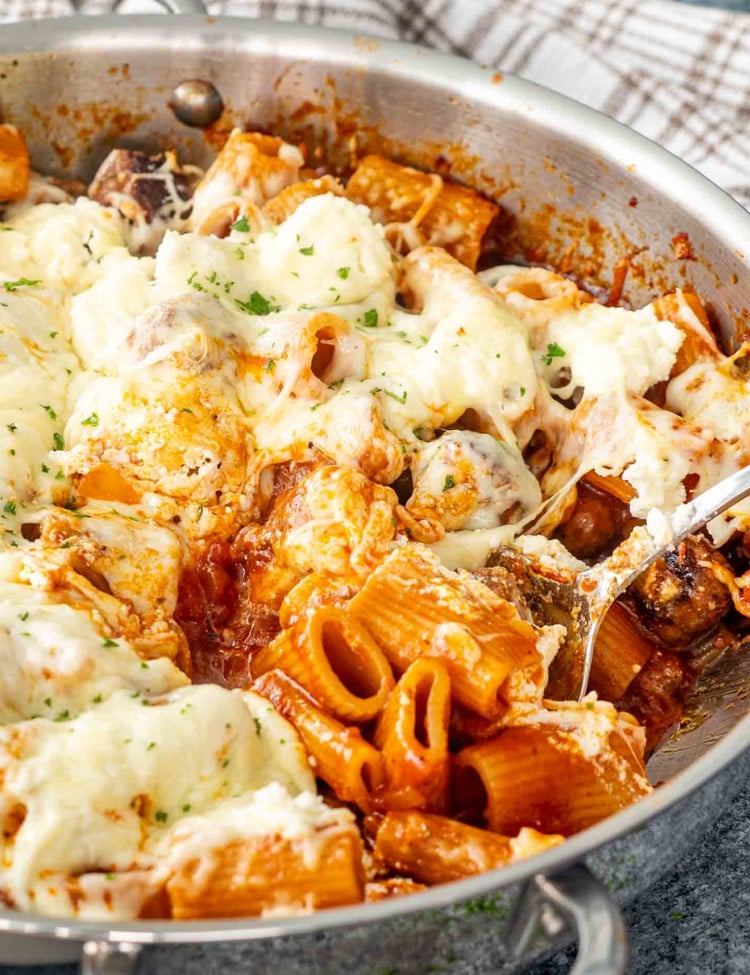 fresh out of the oven one pot sausage meatball pasta in a stainless steel pot.