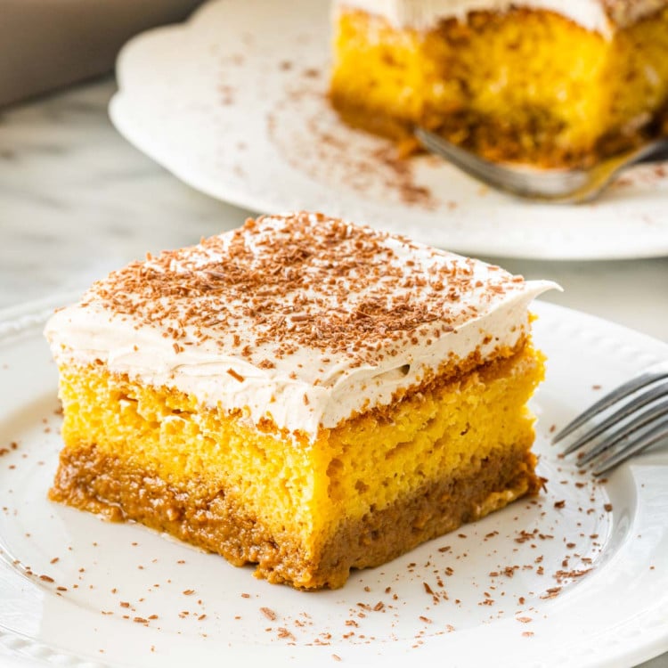 a slice of pumpkin magic cake on a white plate.