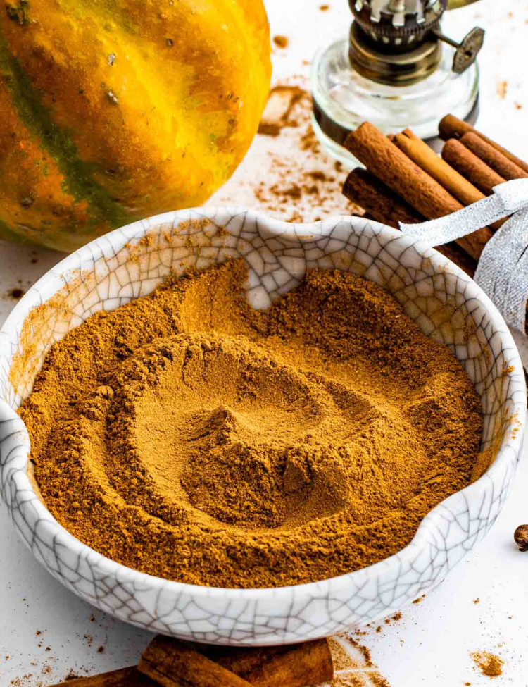 a white bowl with freshly made pumpkin pie spice.