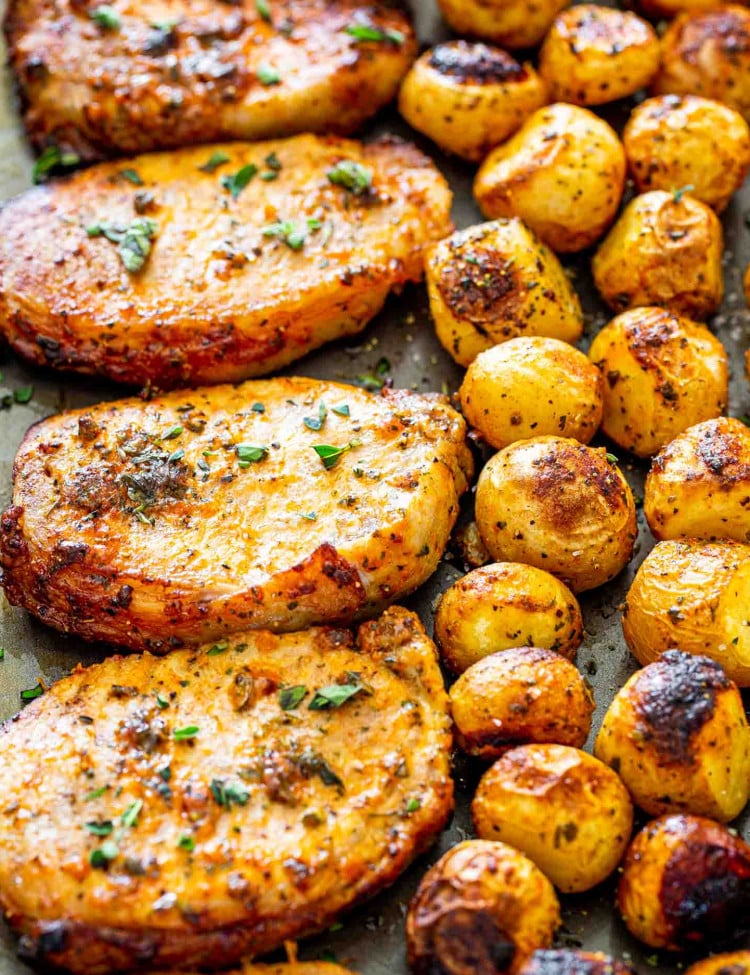 ranch pork chops and potatoes on a sheet pan.