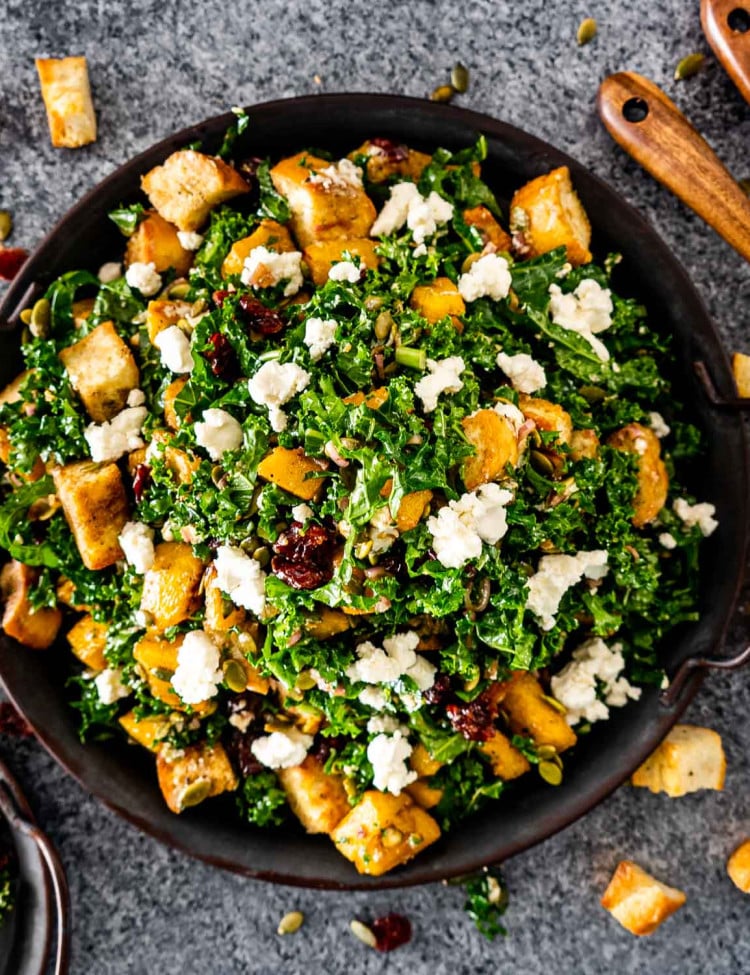 roasted pumpkin panzanella salad in a metal platter.