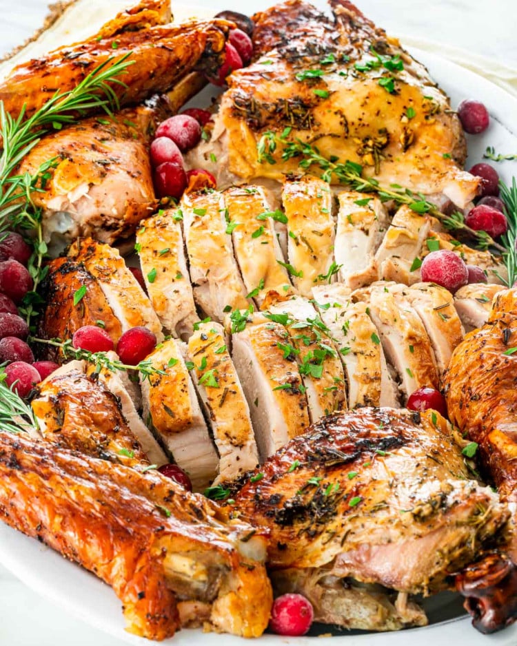 closeup of carved turkey on a serving platter.